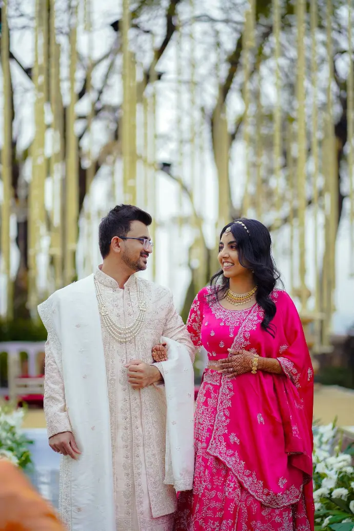 A smiling couple walks happily together.